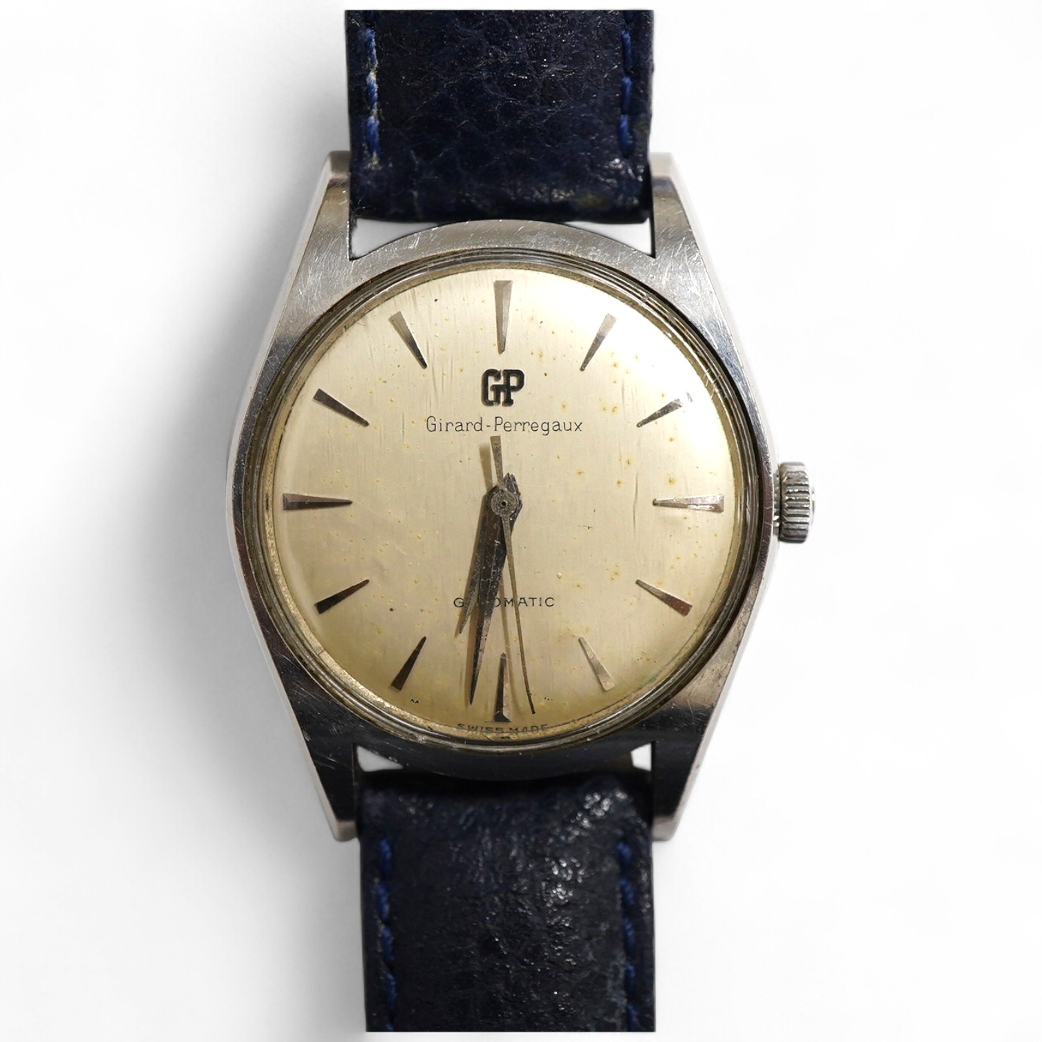 A gentleman's stainless steel Girard Perregaux Gyromatic wrist watch, with baton numerals, case diameter 33mm, on a later associated leather strap, no box or papers.